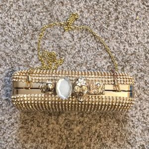 Rhinestone brass knuckle crossbody clutch